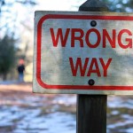 Photograph of a "Wrong Way" sign that symbolizes your mistakes as a high school student, which you need to explain during the college admissions process.
