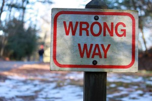 Photograph of a "Wrong Way" sign that symbolizes your mistakes as a high school student, which you need to explain during the college admissions process.