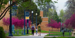 Students walking inside University of Northern Colorado college campus.