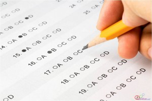 Student pencils in multiple choice answers on their ACT exam. 