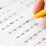 Student pencils in multiple choice answers on their ACT exam.