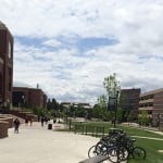 Students walking in University of Nevada, Reno campus with bicycle racks.