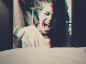 A woman screaming.