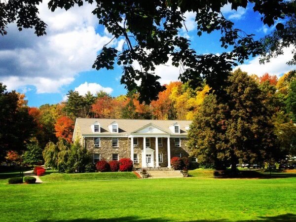 Houghton College campus surrounded by autumn trees.
