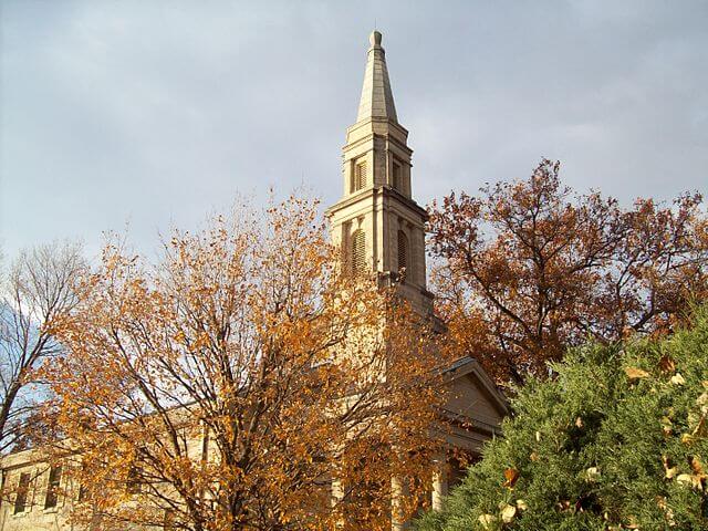 Bell tower at Chapel in the Principia College, surrounded by autumn trees.
