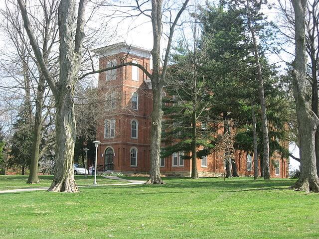 Wilmington College Hall surrounded by trees.