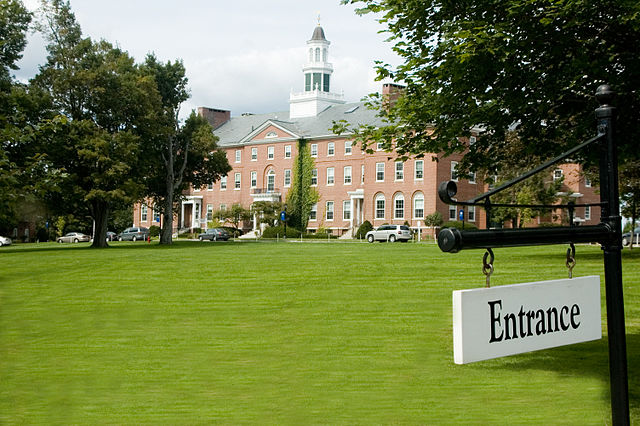 Colby-Sawyer College campus field and an entrance sign on the foreground.