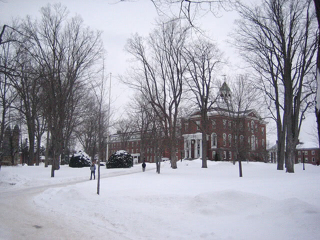 Students walking through a snow covered campus at Bates College.