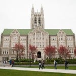 Students walking outside the O’Neill Library at Boston College.