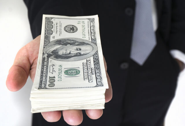 Photograph of money. Is income-based student loan repayment for you?