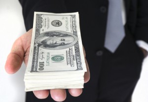 Photograph of money. Is income-based student loan repayment for you?