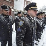 Officers lined up on snowy weather.