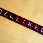 Scrambled letters arranged as the word "declined".