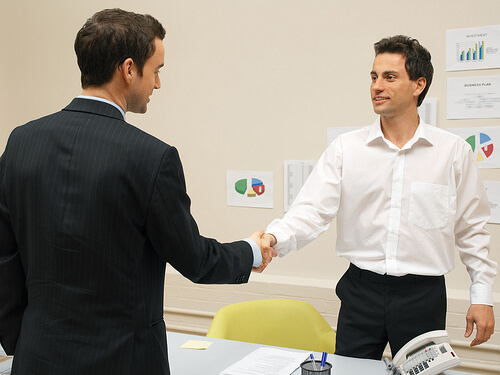 Businessmen shaking hands by reynermedia hand shake photo