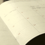 A schedule open to a monthly page.