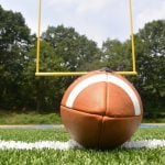 A football lying on the ground close up.