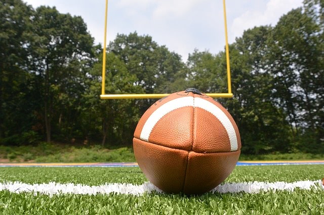 A football lying on the ground close up.
