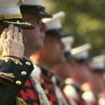 Military personnel saluting.