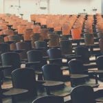 Rows of chairs in a lecture hall.