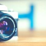 A close-up of a camera sitting on a table.