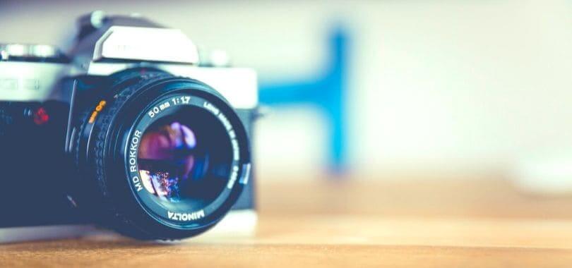 A close-up of a camera sitting on a table.
