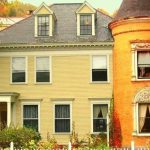 A beige and orange house in New England.