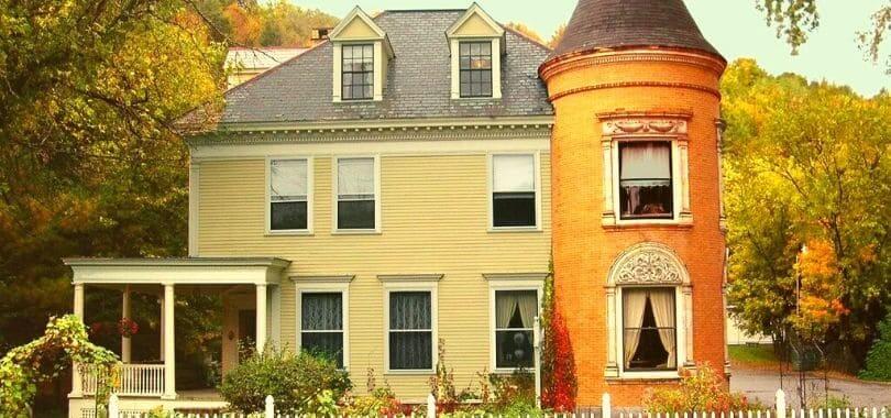 A beige and orange house in New England.