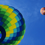 Three hot air balloons in the sky.