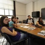 College students listening on a classroom lecture.