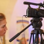 College student standing in front of a camera.