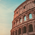 The Colosseum with a sunset in the background.