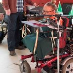 Joanne O’Riordan, a girl with no limbs, in a wheelchair giving a speech.