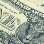 A close-up picture of a one dollar bill.