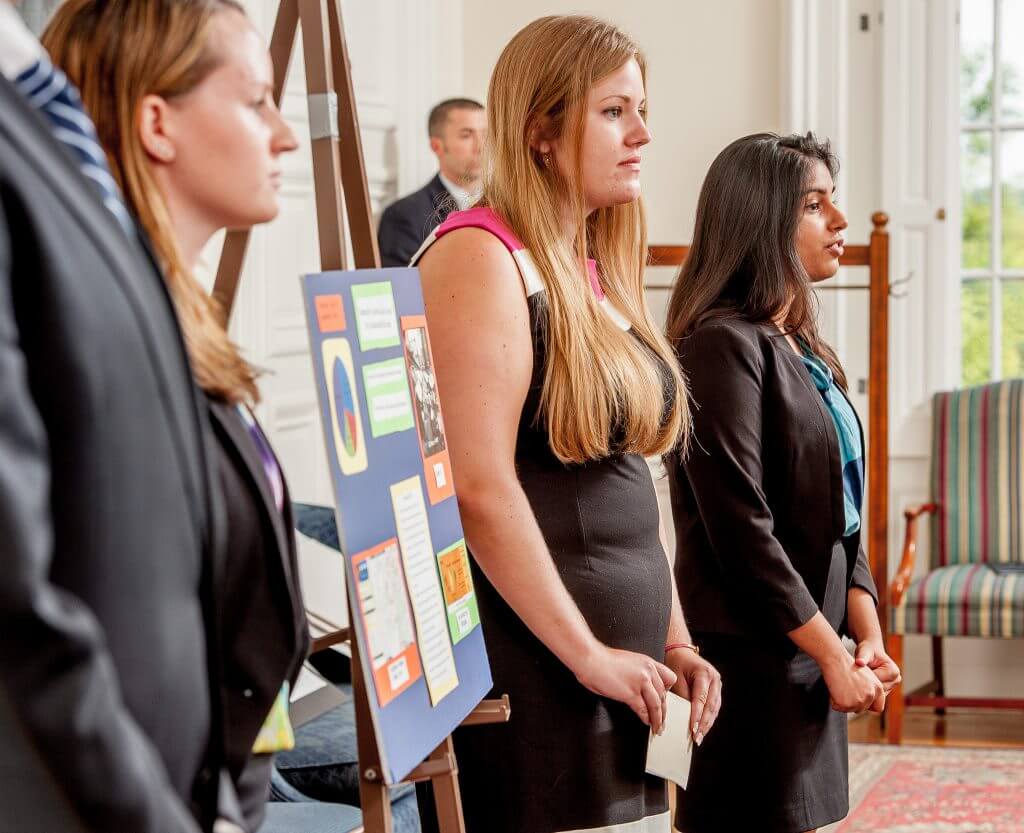 Business interns giving a presentation at their company.