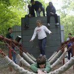 Students on a challenging obstacle course as part of orientation.