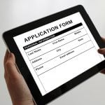 An online college application form in an iPad.