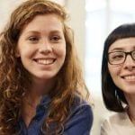 Two students sitting side by side.