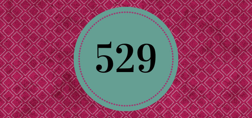 A purple background with a dark green circle, with the number 529 in the center.