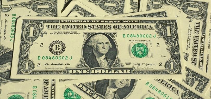 Dollar bills stacked on top of each other.