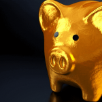 A golden piggy bank with a dark background.