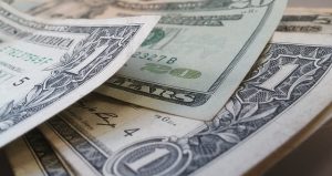 Dollar bills stacked on each other.