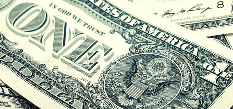 A zoomed in shot of a dollar bill.