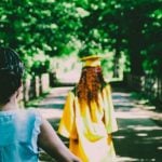 Parents walking behind their graduating student.