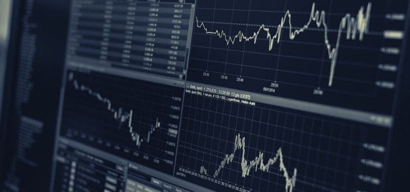 Stock market windows shown on a computer monitor.