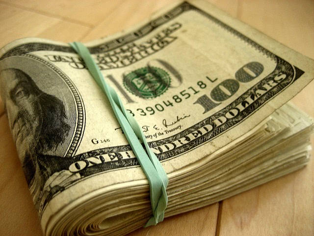 $100 dollar bills tied in a band.