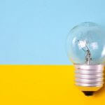 A light bulb against a blue and yellow background.