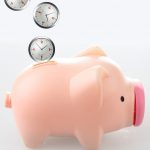 Three clocks dropping to a piggy bank represents saving time.