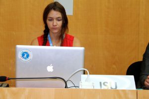 Serious female student using her laptop.