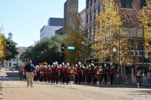 Jackson State University marching band parading on the street.