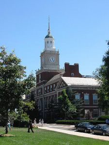 Howard University campus building with students walking around.